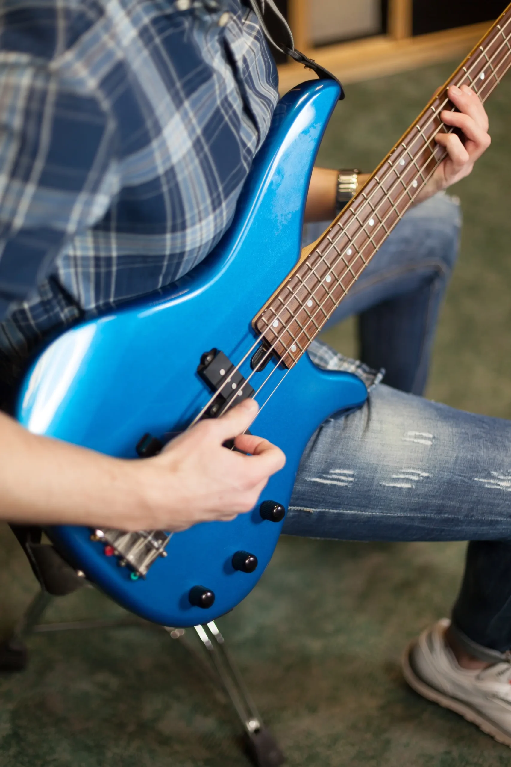 guitarist-with-blue-guitar-side-view